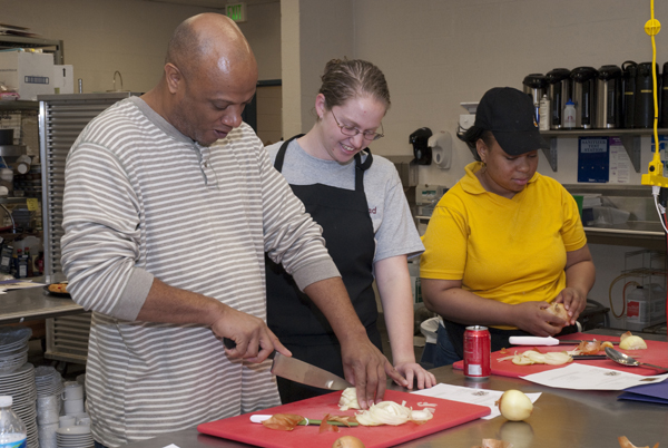 UMES Hotel and Resturaunt Management student, Katie Keely provides instruction in food preparation
