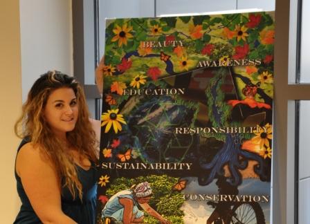 scholarship winner with mural