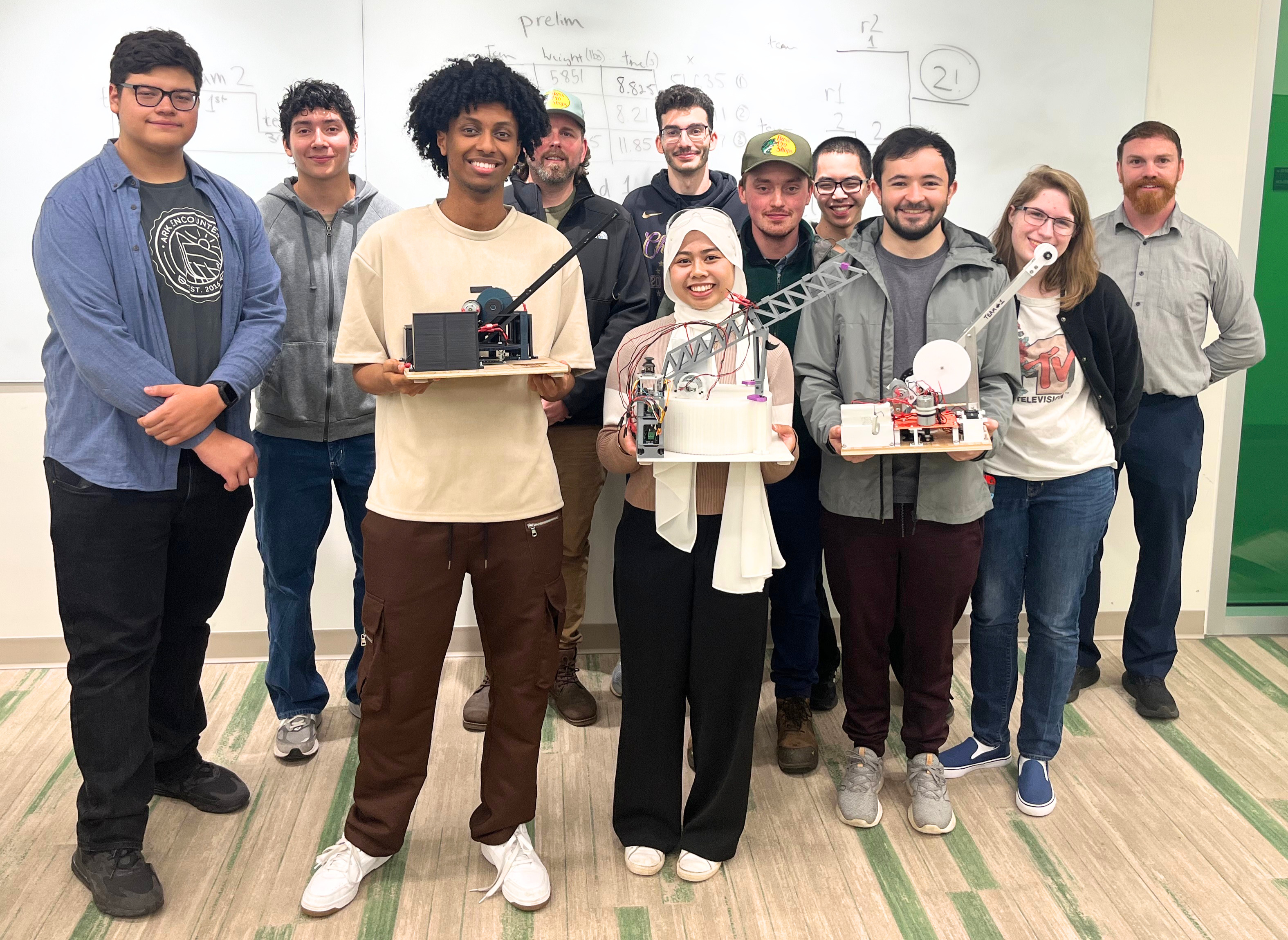 UMBC Mechanical Engineering students with their projects