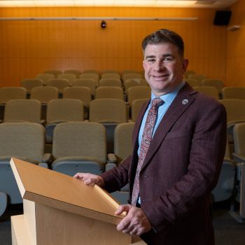 Justin Barclay at classroom podium