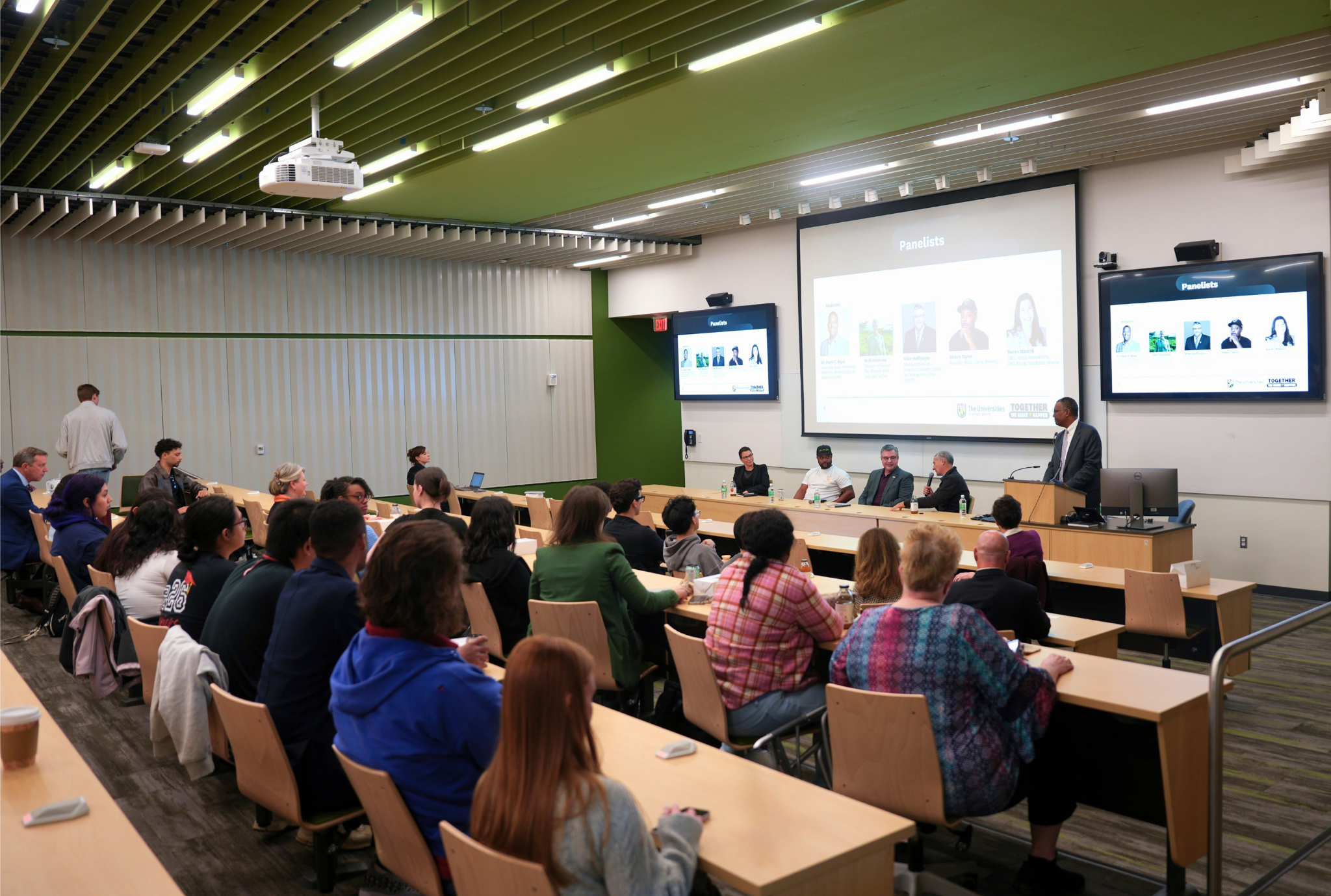 Auditorium full of students attending a speaker panel