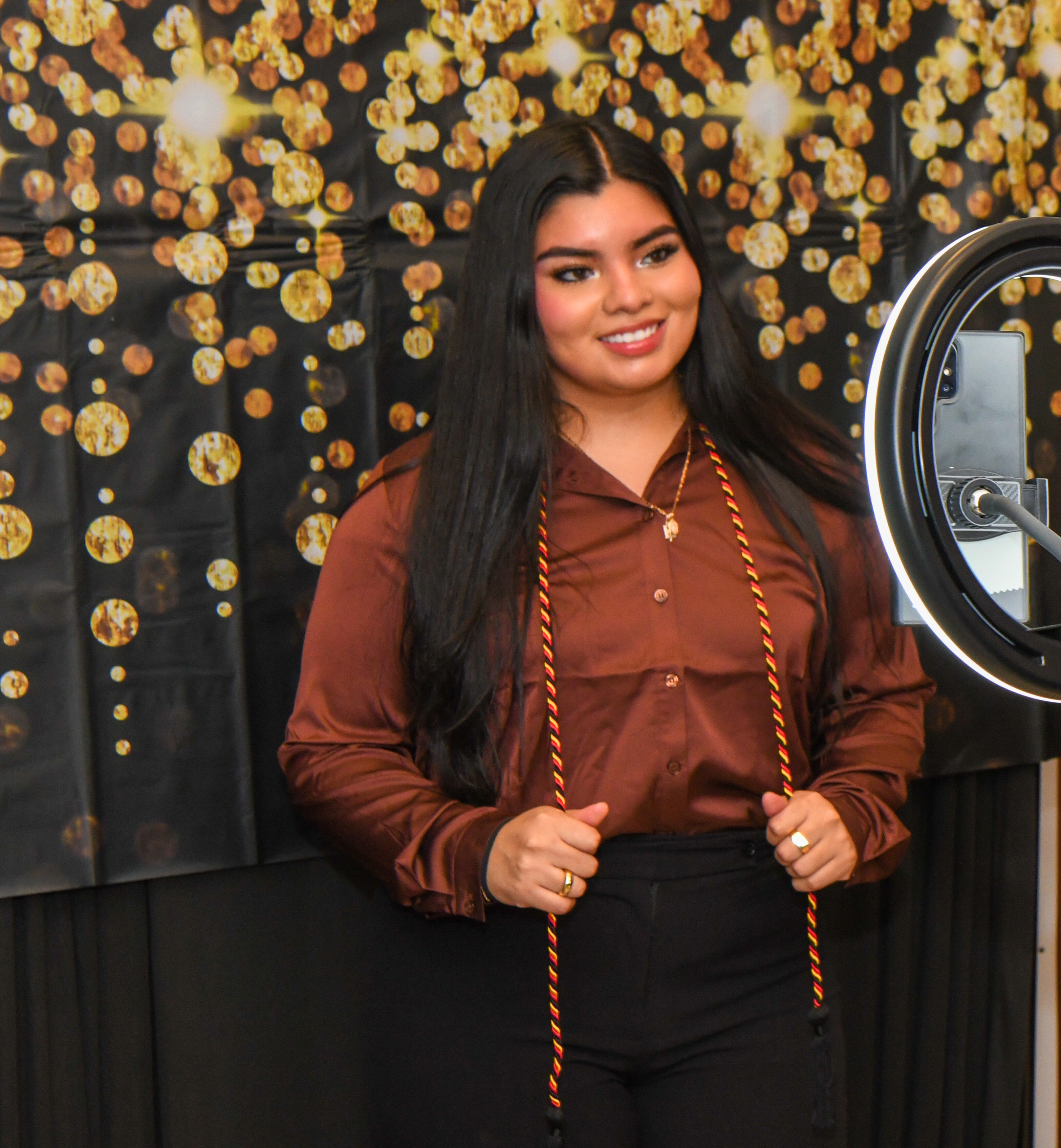 Student posing with their HireU cord