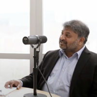 Man sitting behind a microphone