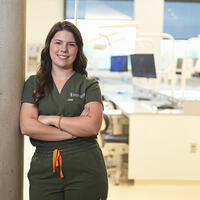 Emily Chaffer standing outside dental simulation lab