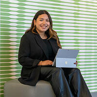 Melany Claros on laptop