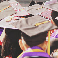 College graduates in cap and gown