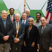 Photo of Dr. Khademian at MOU signing event with county officials