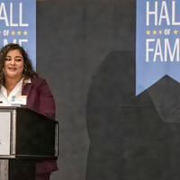 Sirelmy “Sisi” Santos speaking at podium
