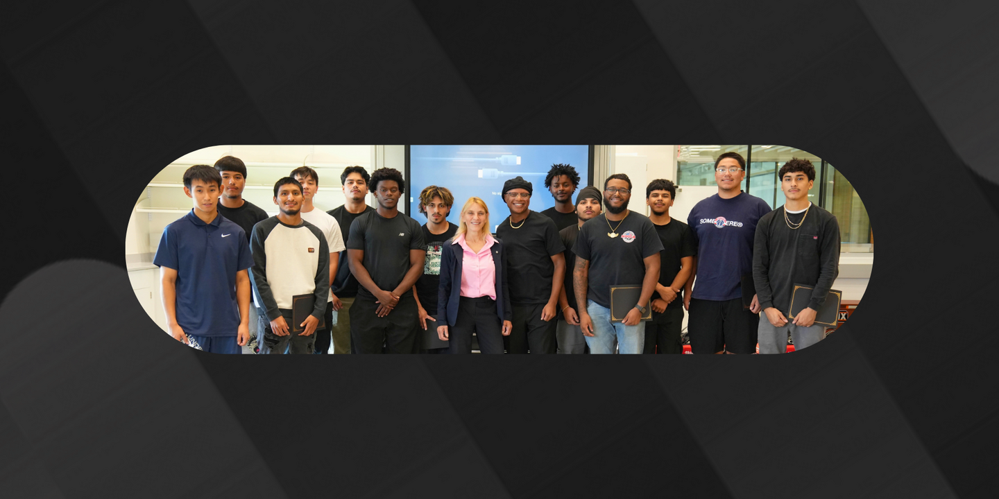 Participants posing as a group with their certificates