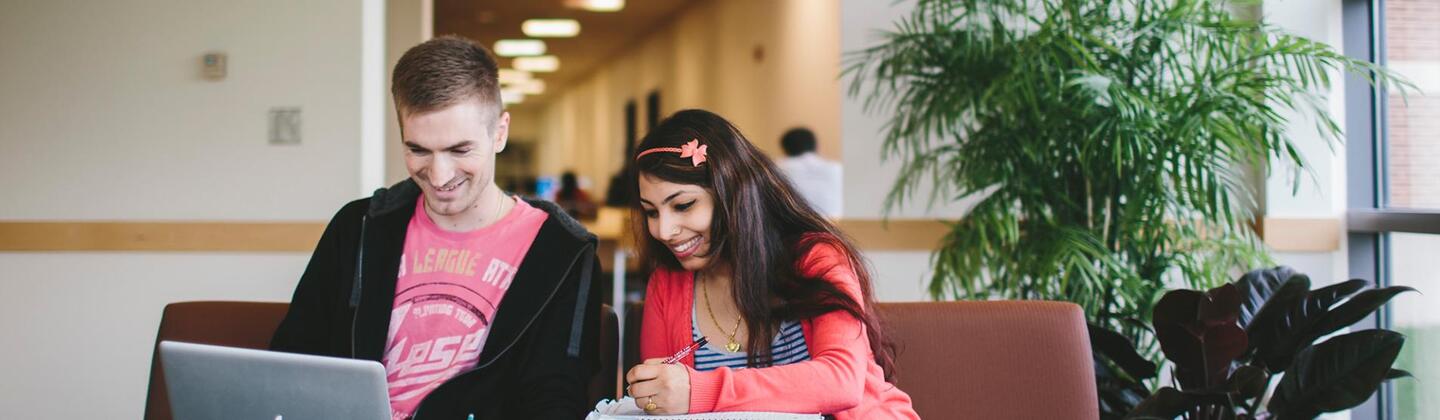 Two students in a library