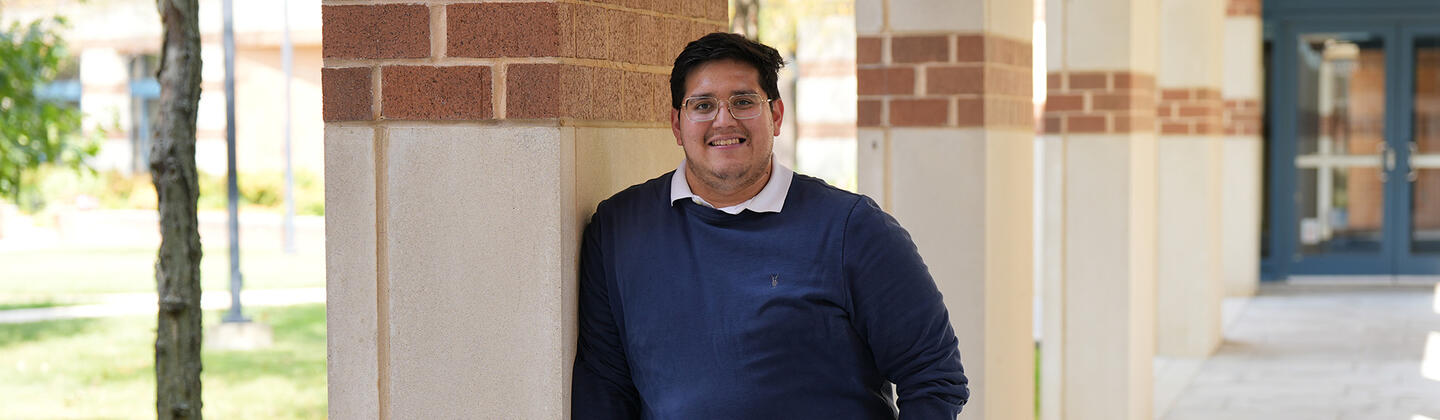 Jonathan Gomez outside building on USG campus