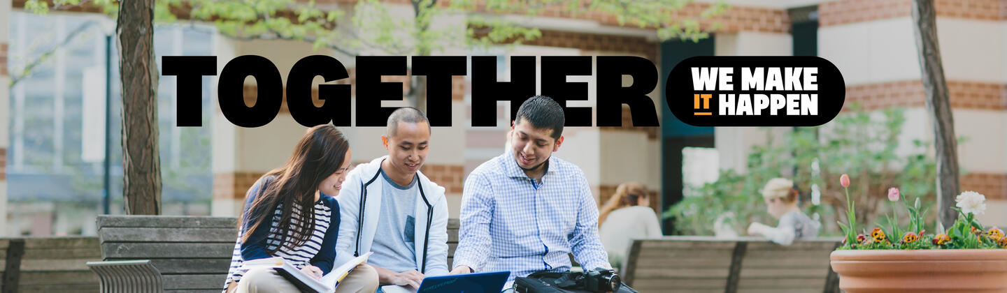 Three students sitting outside of a university building with "Together We Make It Happen" underneath