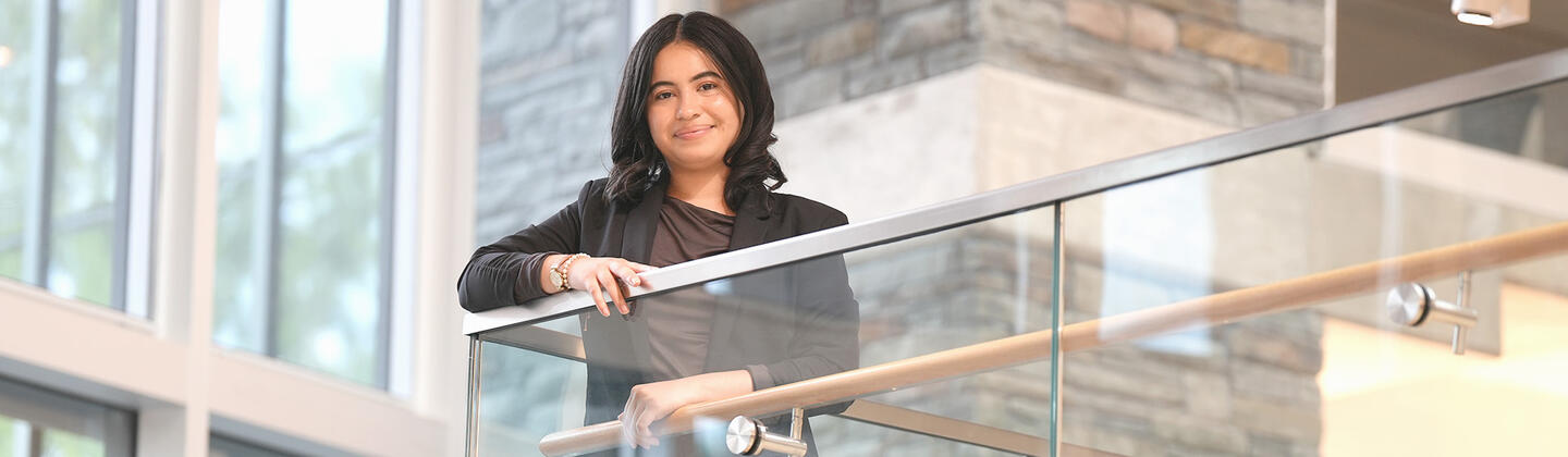Student, Magaly Lizama Hernandez, standing on stairway landing