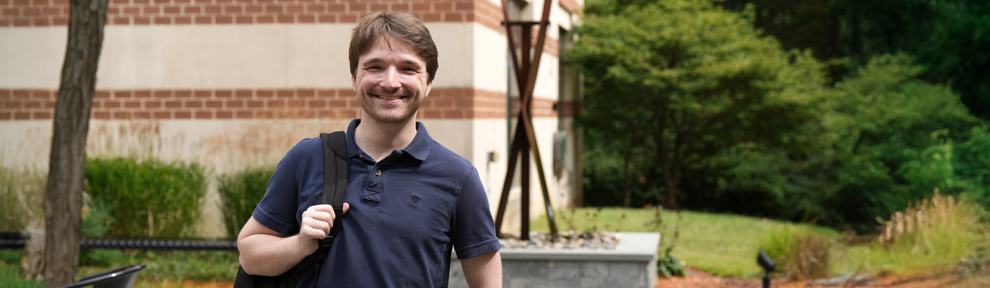 Oliver Salter standing outside on USG campus