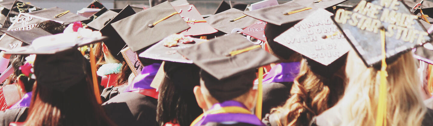College graduates in cap and gown