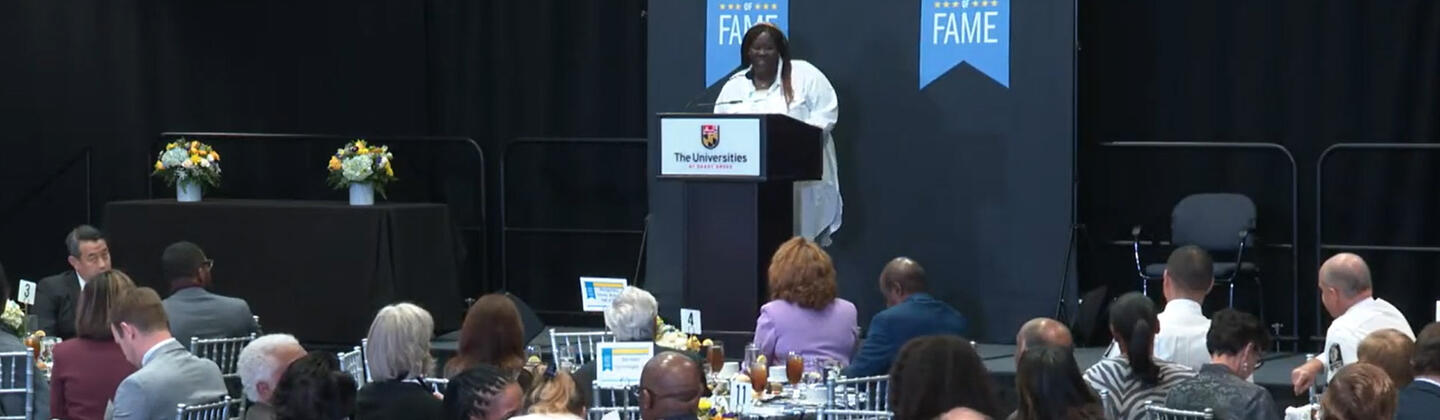 Nadine Dogbo speaking at Montgomery County Business Hall of Fame event