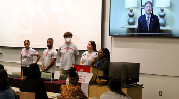 Annie E. Foster Ahmed Leading Tau Sigma Honors Society Meeting
