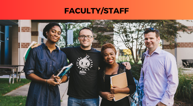 Staff members smiling at the camera