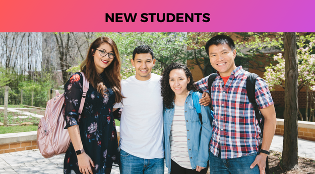 Students standing and smiling in a group
