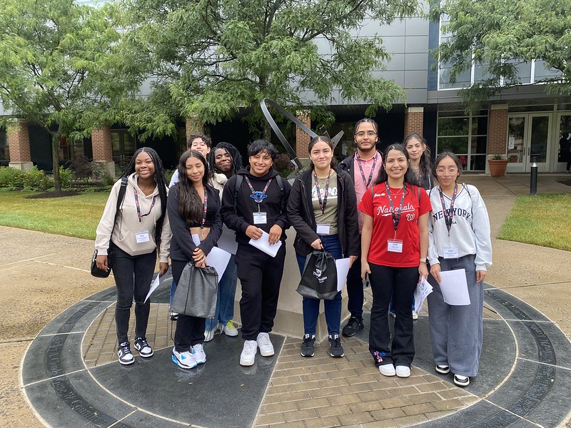 Students posing for picture on the campus of the Universities at Shady Grove