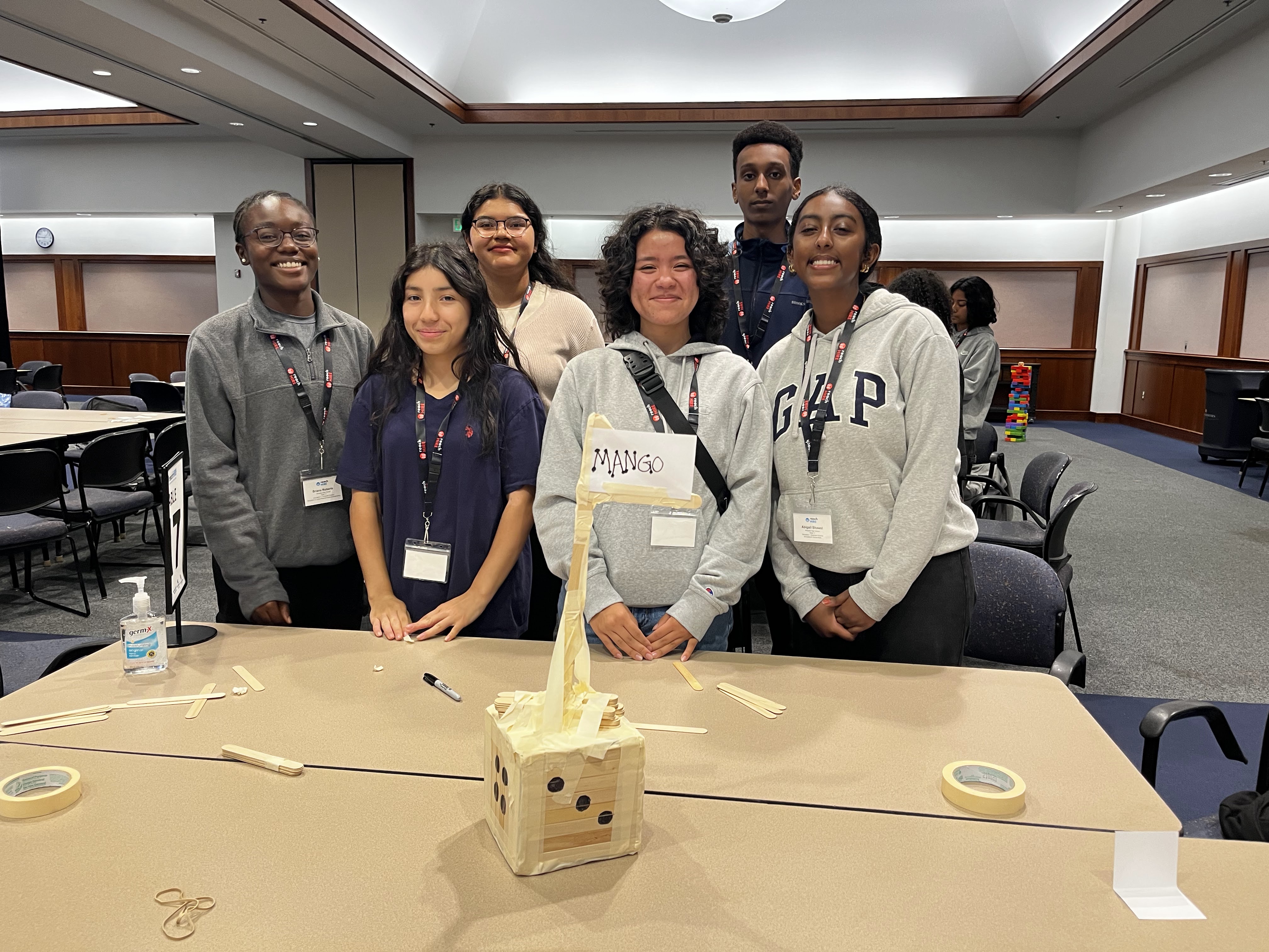 Students complete a tower building challenge at 2023 reachHIRE.